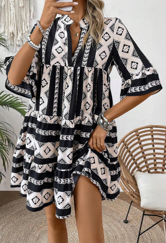 Black geometric v neck dress fits like an XL